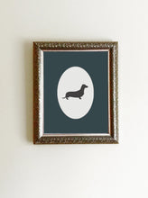 Load image into Gallery viewer, black and white dachshund silhouette framed with blue photo mat
