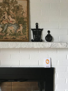 fireplace mantel with yellow ducky flash card