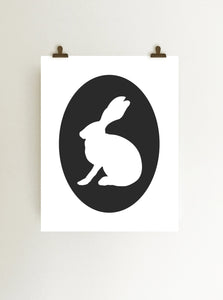 Black rabbit cameo giclee art print on white fine art paper shown hanging from clips on wall
