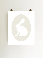 Load image into Gallery viewer, Ivory rabbit cameo giclee art print on fine art paper shown hanging on wall from clips
