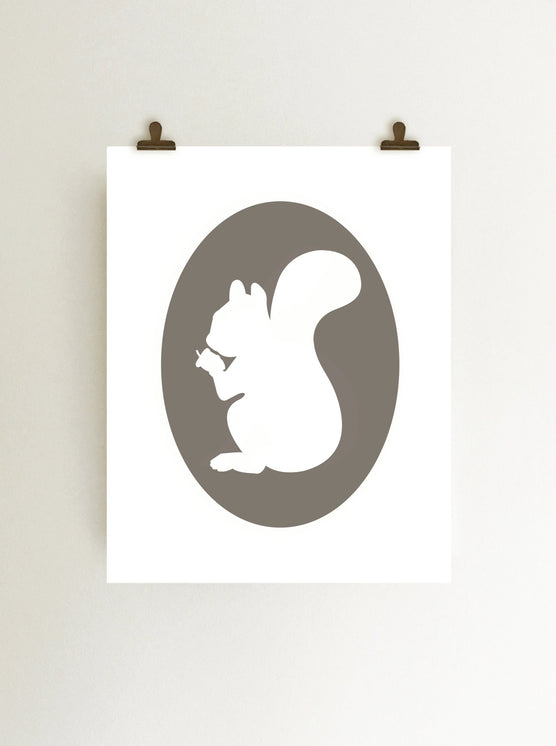 Gray squirrel holding acorn cameo art print, giclee on white fine art print paper shown hanging on wall from clips